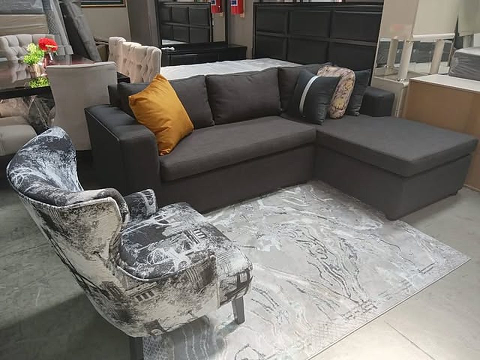 Charcoal corner couch in the showroom